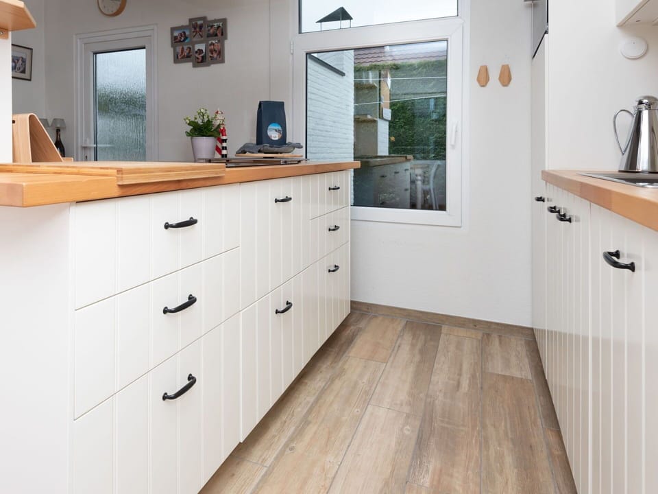 Countertop, Cabinetry, Kitchen, Flooring, Furniture, Wood, Interior Design, Floor, Kitchen Appliance, Drawer