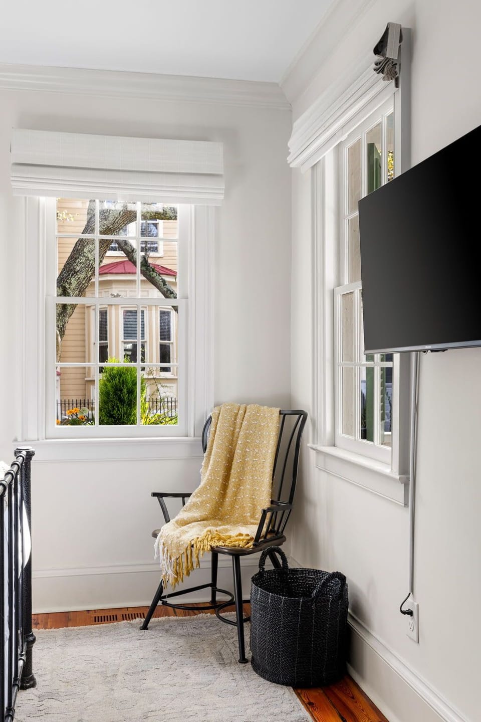 A simple dressing chair, adding a touch of comfort and convenience to the space.