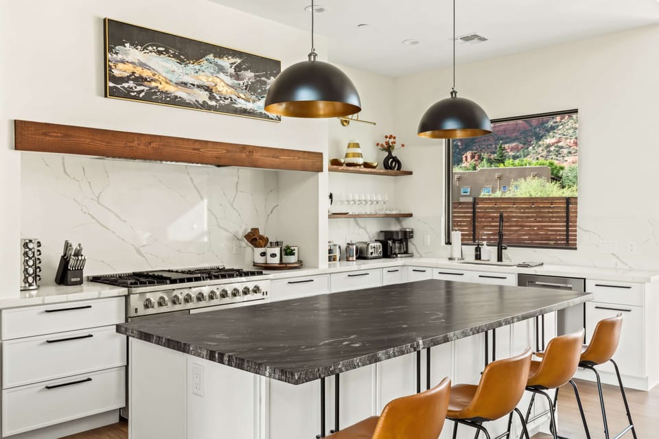 Stylish countertops and open layout make this the heart of your desert stay.