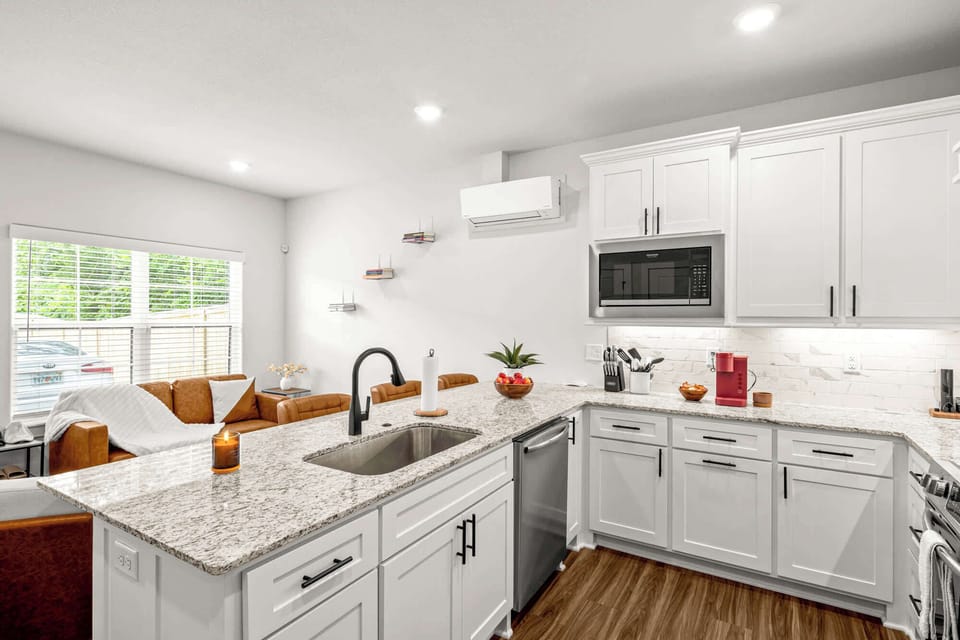 Clean, minimalist lines blend seamlessly with welcoming warmth. This kitchen stands as a showcase of intentional design and practical elegance.