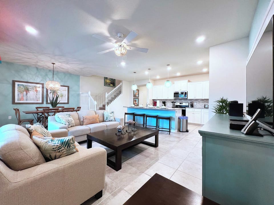 Relax in the spacious open-concept living area with a large flat-screen TV, high-speed Wi-Fi, and comfortable seating for everyone.