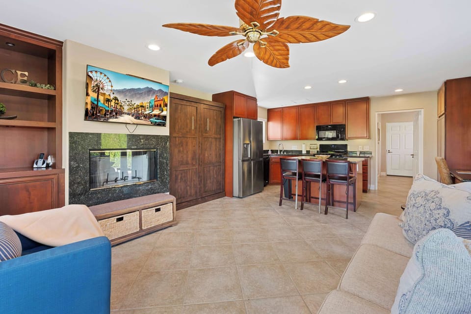 Living area with comfy seating, Smart TV, and murphy bed