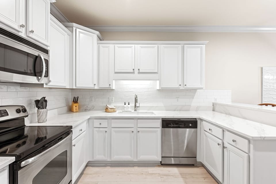 Kitchen: Newly renovated with new countertops, fixtures, and appliances