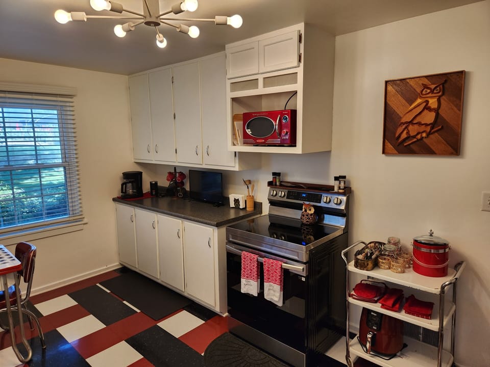 Wake up to coffee in a spacious, light filled kitchen overlooking the backyard