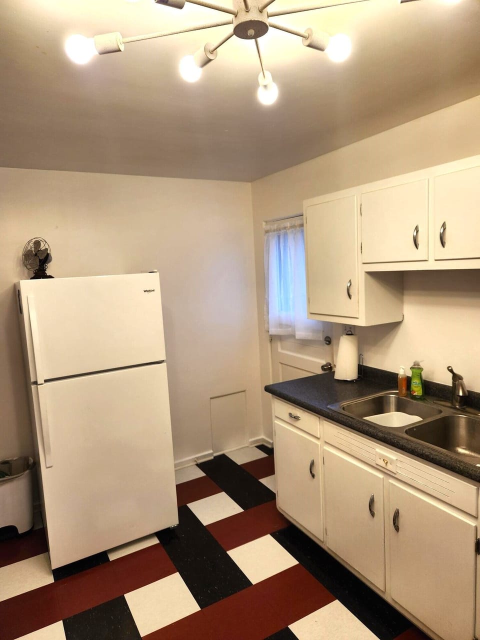 The spacious kitchen leads to a beautiful, park like setting in the backyard