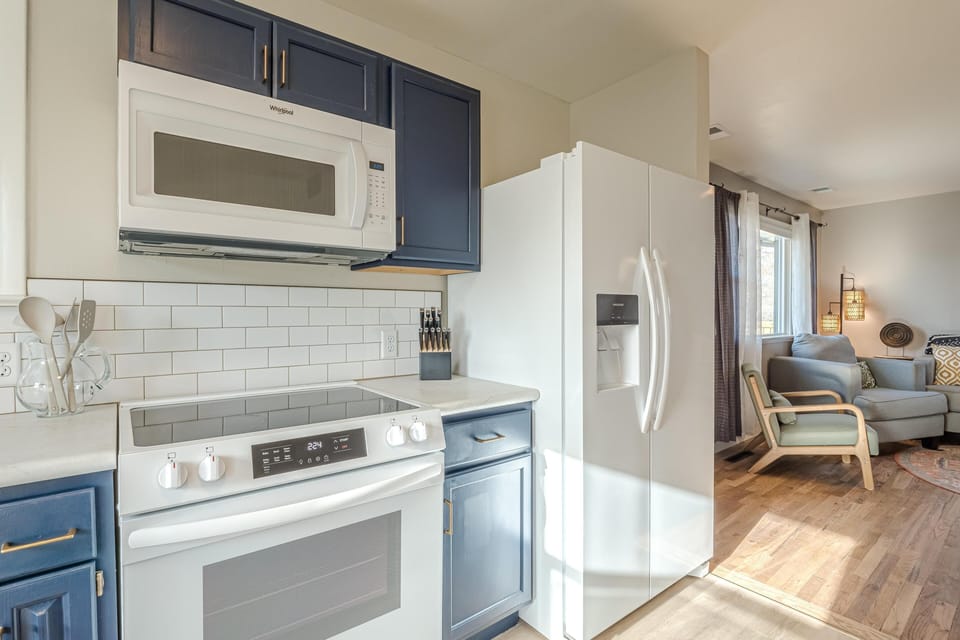 A full sized microwave, range, and fridge offer a wide variety of ways to prepare food.