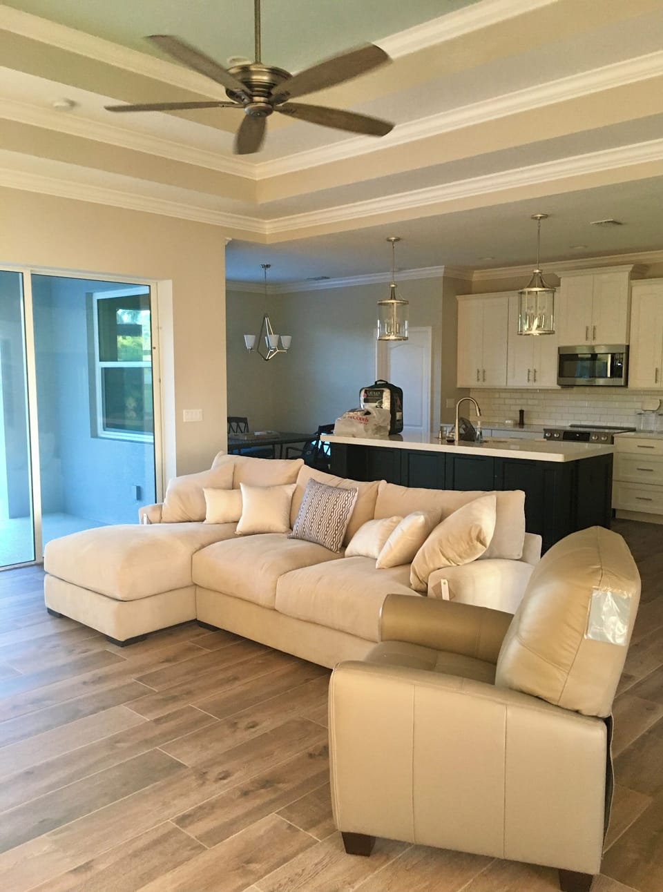 Living room with sectional and 2 reclining leather chairs