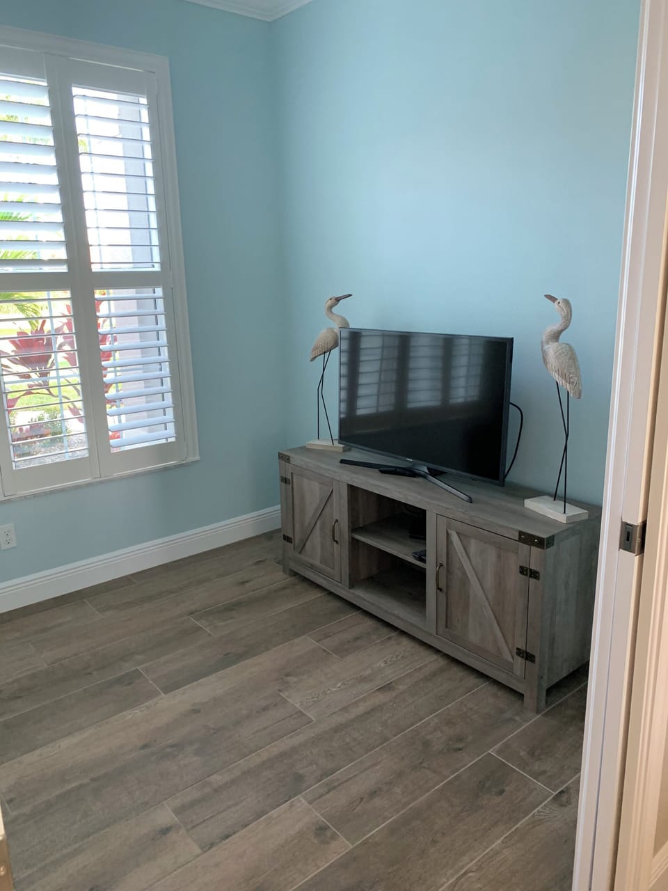 Den with couch and TV