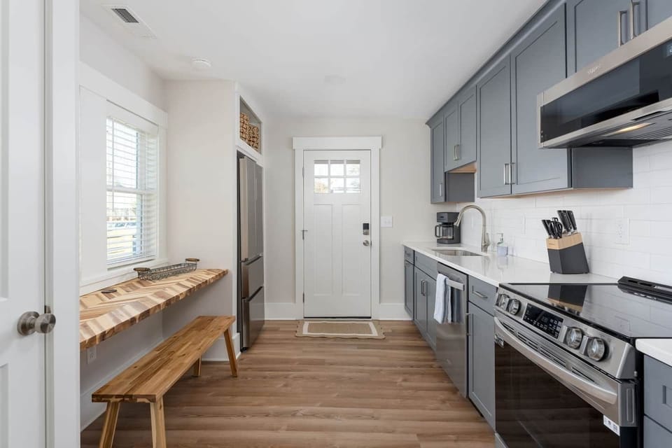Walk from private off street parking into the bright and airy kitchen, complete with all you need.