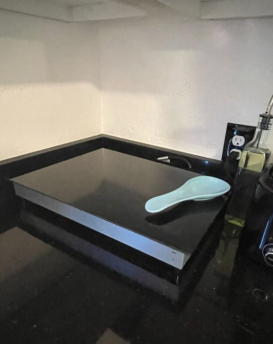 You must put a pan on the cooktop then turn it on, or you will get an error