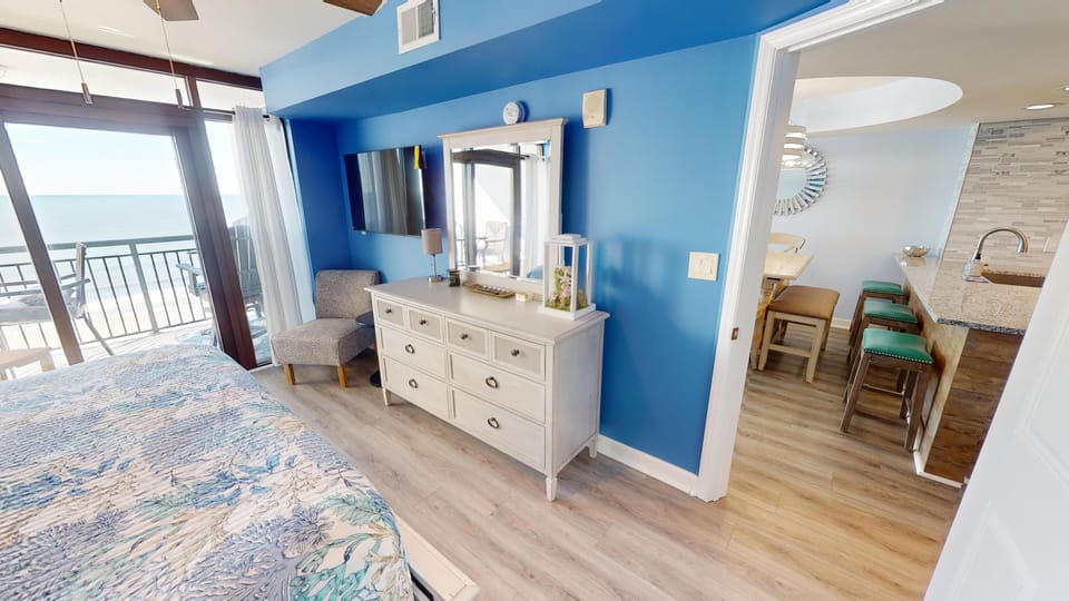 Primary bedroom - featuring a king bed and private bathroom, offering a comfortable space to unwind at the end of the day.
