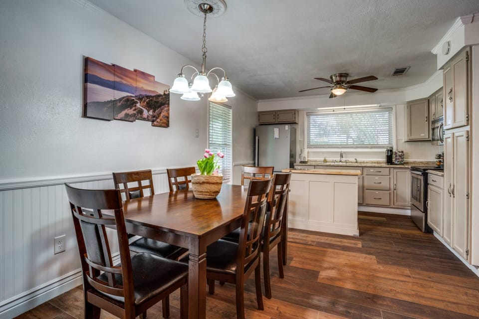Warm, open layout connects the living and dining rooms—ideal for gathering, playing games, sharing meals, and making lasting memories together.