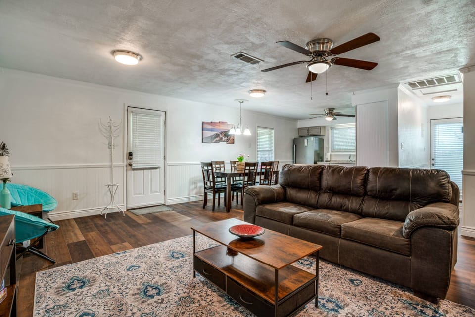 Open floor plan with cozy living, dining, and sitting areas—perfect for relaxing, sharing meals, and enjoying time together.