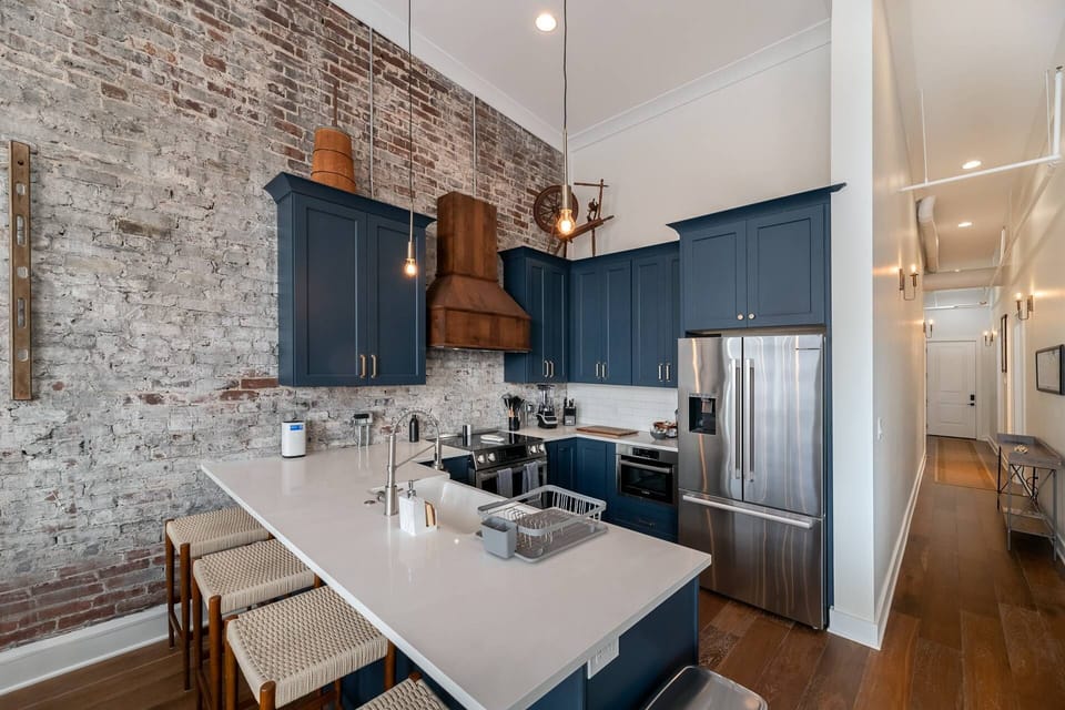 The kitchen comes stocked with essentials, a Keurig Coffee Maker, and seating for 4 at the counter. Down the hall are the bedrooms, bathrooms and exit