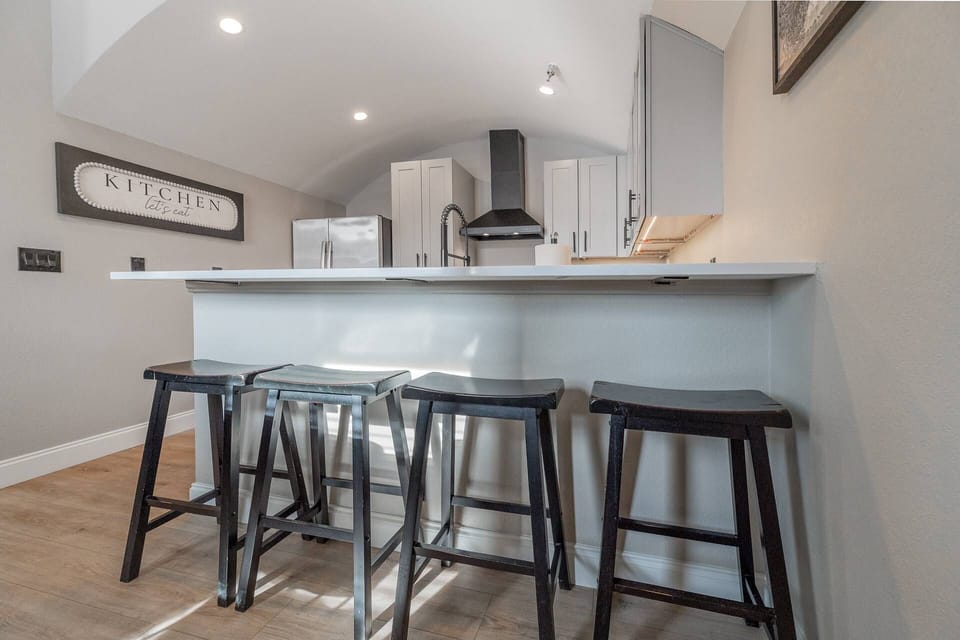 The high-top bar in the kitchen offers seating for 4