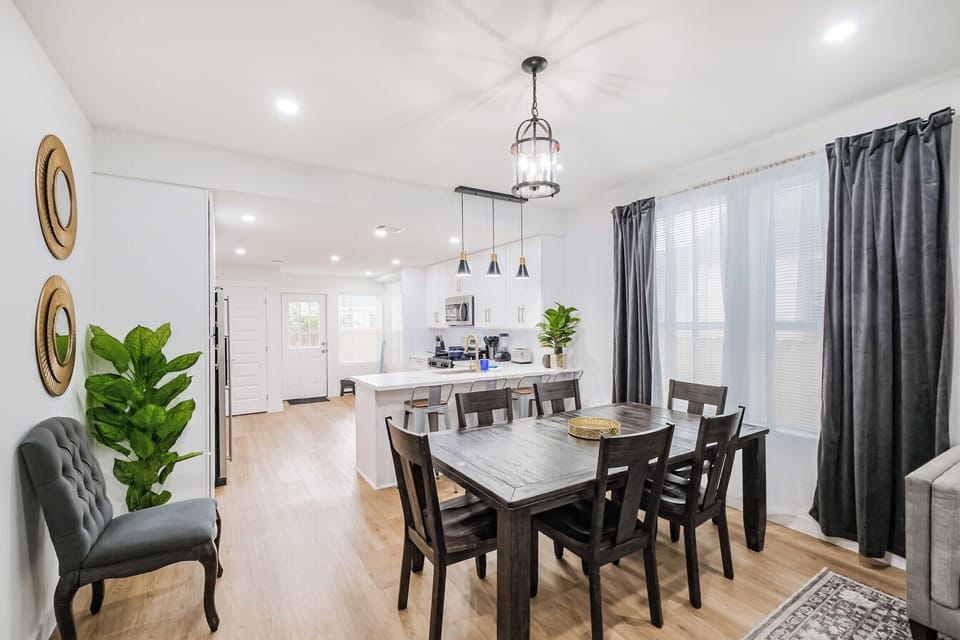 The spacious dining area seats up to eight comfortably, making it perfect for group meals, celebrations, and shared experiences around the table.