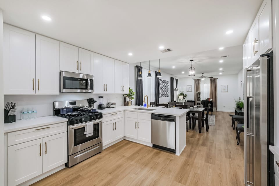 Fully equipped kitchen with modern appliances, cookware, and utensils, ready for any culinary needs.