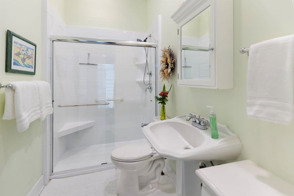 Step into your pristine private bathroom featuring a sparkling shower, fresh towels, and thoughtful touches that make you feel right at home.