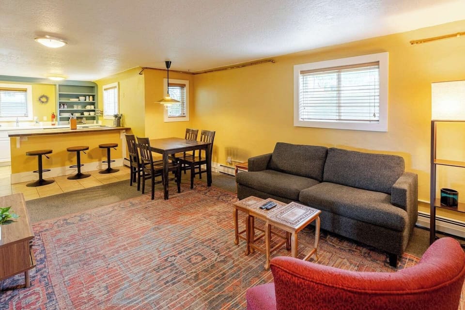 Several seating options in this open-concept kitchen/dining/living room make gathering easy. 