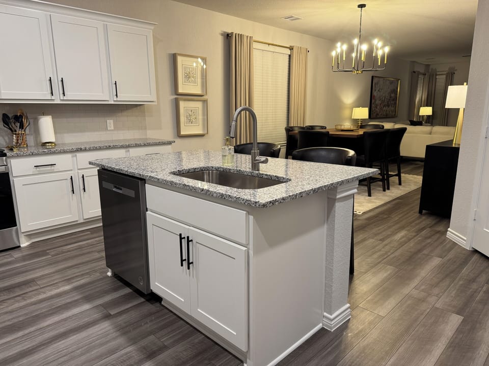 Open plan Kitchen/dining/living room spans the front of the house.