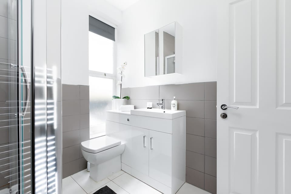 A bright, modern bathroom with clean lines and a fresh design for a relaxing start or end to your day.