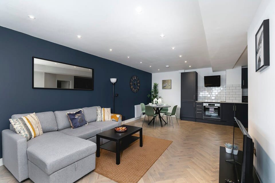 Open-plan living and dining area with stylish dark accents
