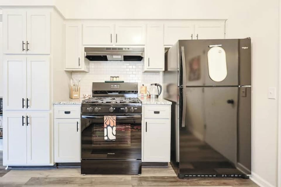 Full-size kitchen with stove, fridge, and ample storage