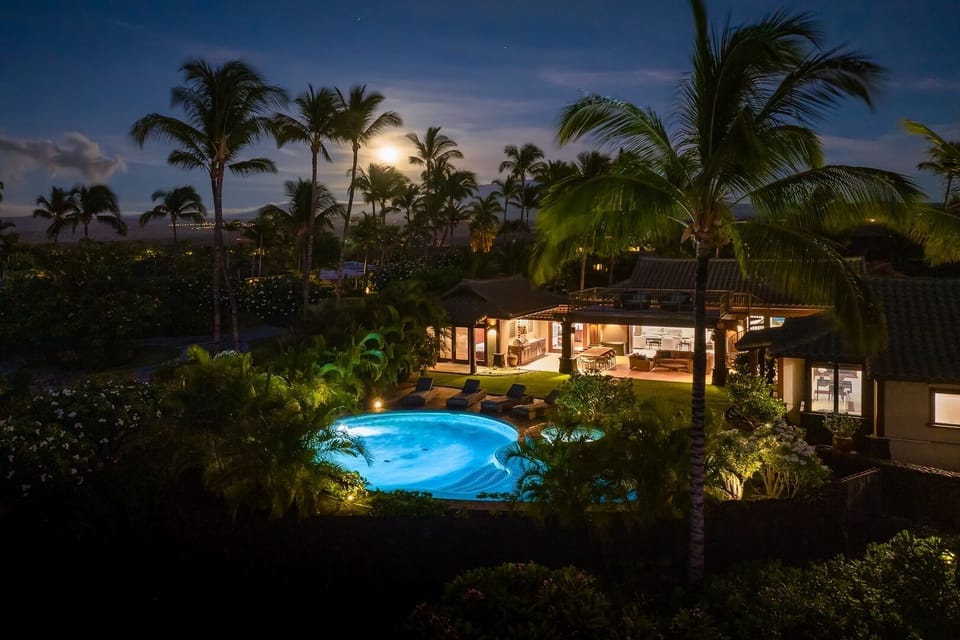 Magical evenings await—unwind in the glowing pool under moonlight and swaying palms.