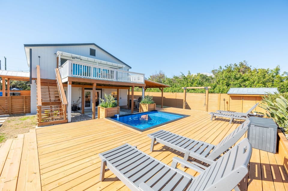Private pool with spacious deck and sun loungers for ultimate relaxation.