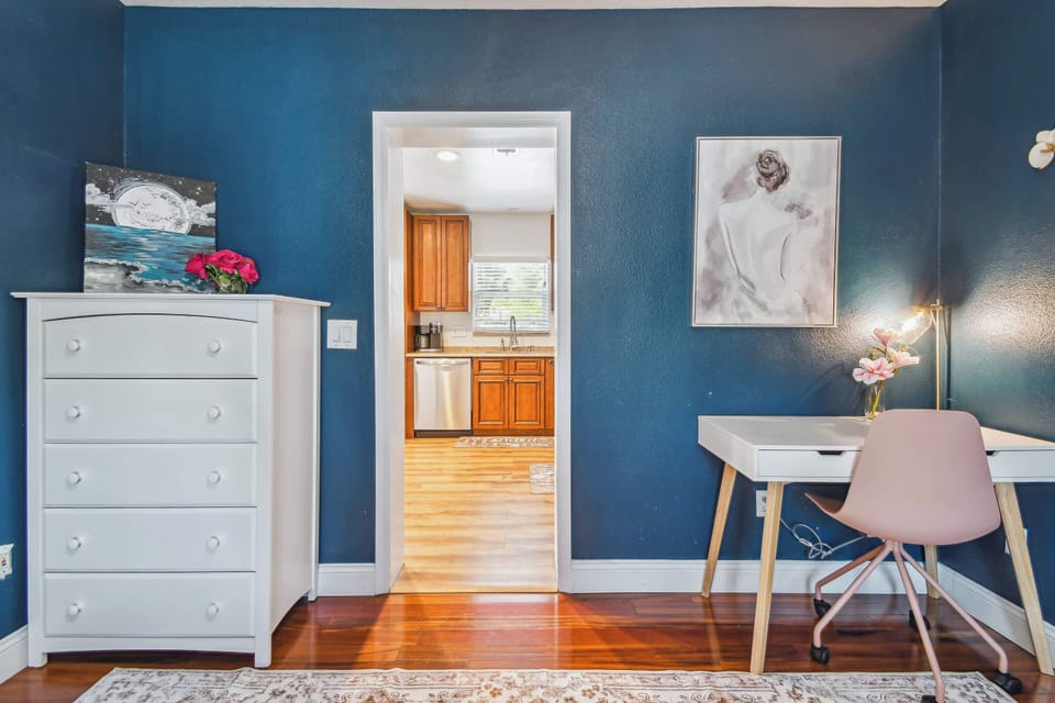 Well-appointed bunk bed bedroom in Clearwater featuring workspace, storage, and coastal décor. Direct kitchen access for a convenient Clearwater Stay. 