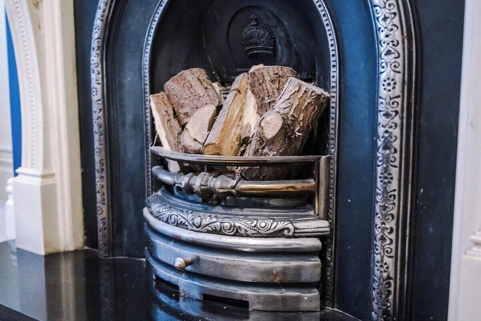 Warm up by the stylish fireplace – a perfect living room centerpiece.