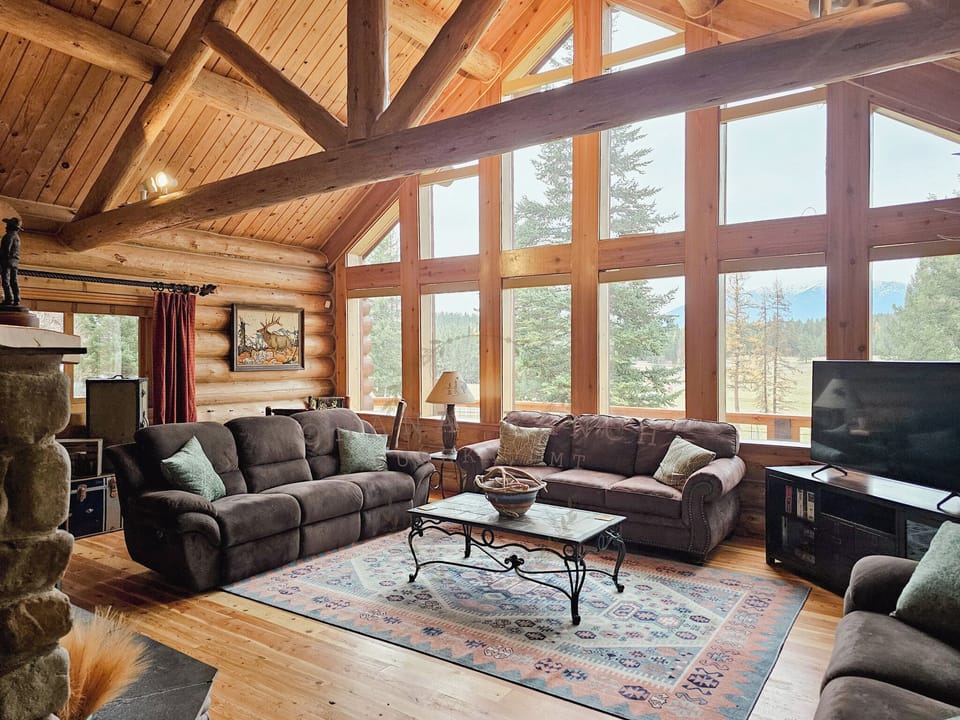 River Rock Living Room: Queen size couch bed, tv, fire place, reading nook, & puzzle table. (1)