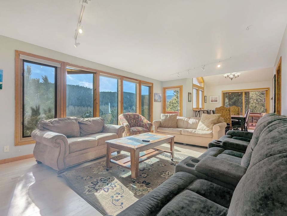 Light filled living room with mountain views
