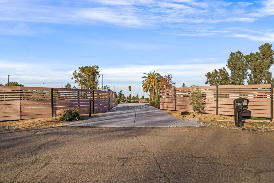 Modern elegance meets spacious living! Explore this stunning single-story home with a sleek concrete driveway, lush landscaping, and timeless charm. Your dream home awaits!