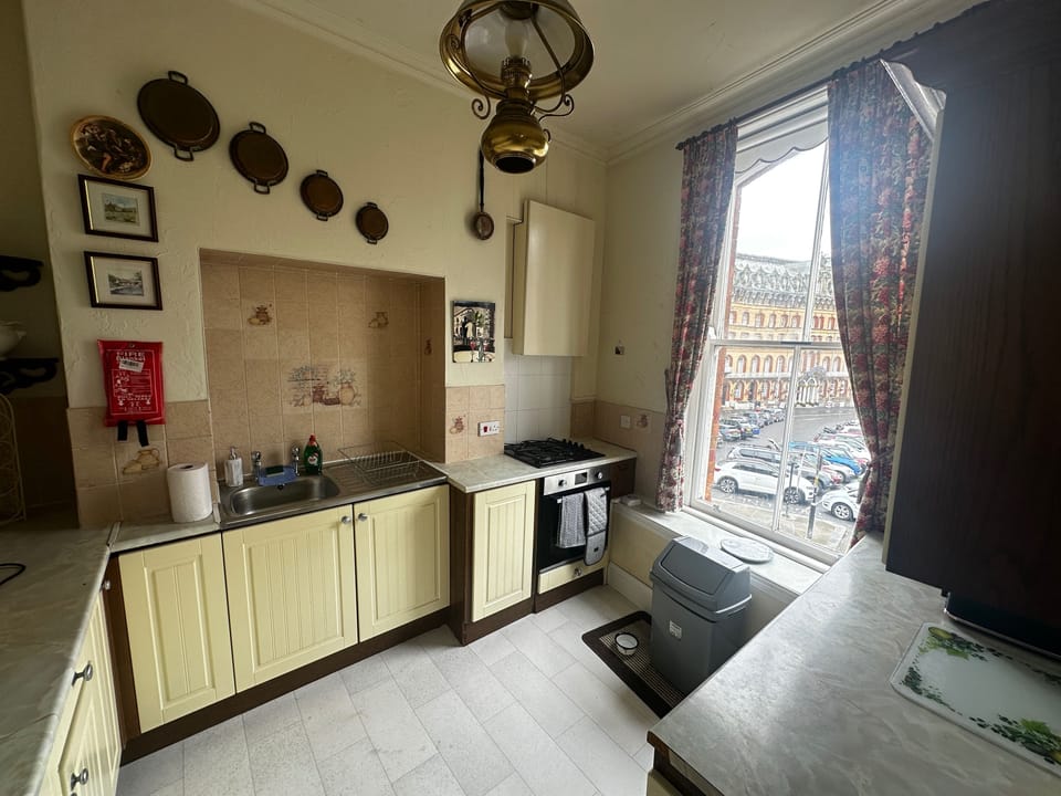 Kitchen with gas hob, gas cooker. Fridge with freezer compartment. Washing machine. Toasters, Air Fryer, Slow Cooker, Microwave. Cooking pans dishes, plates, cutlery etc. Sea views