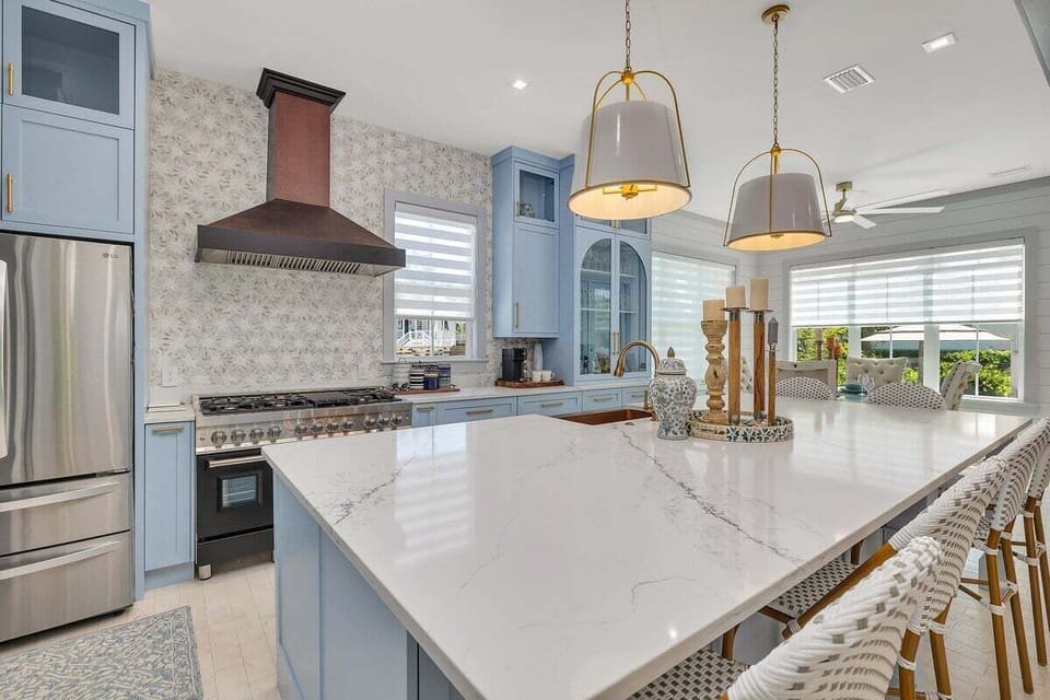 Close-up of kitchen island and blue cabinetry