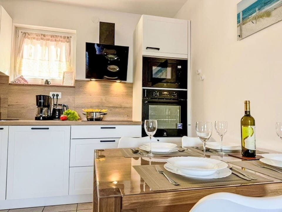 Furniture, Kitchen Appliance, Countertop, Kitchen, Cabinetry, Interior Design, Major Appliance, Flooring, Home Appliance, Wood