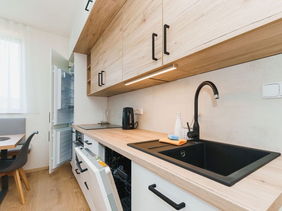 Countertop, Kitchen, Cabinetry, Interior Design, Furniture, Kitchen Appliance, Wood, Flooring, Major Appliance, Sink