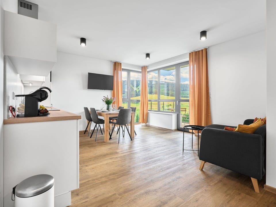 Furniture, Interior Design, Flooring, Wood, Ceiling, Floor, Room, Apartment, Lighting, Chair
