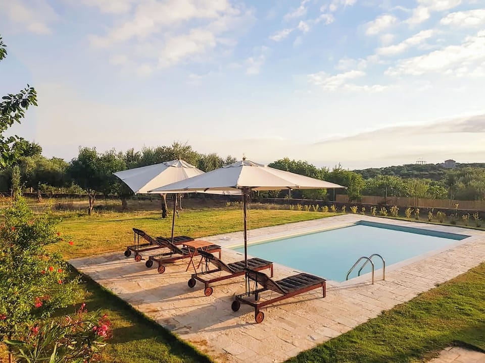 Private Pool Area – Exterior view – Surrounded by olive trees and stone paths


