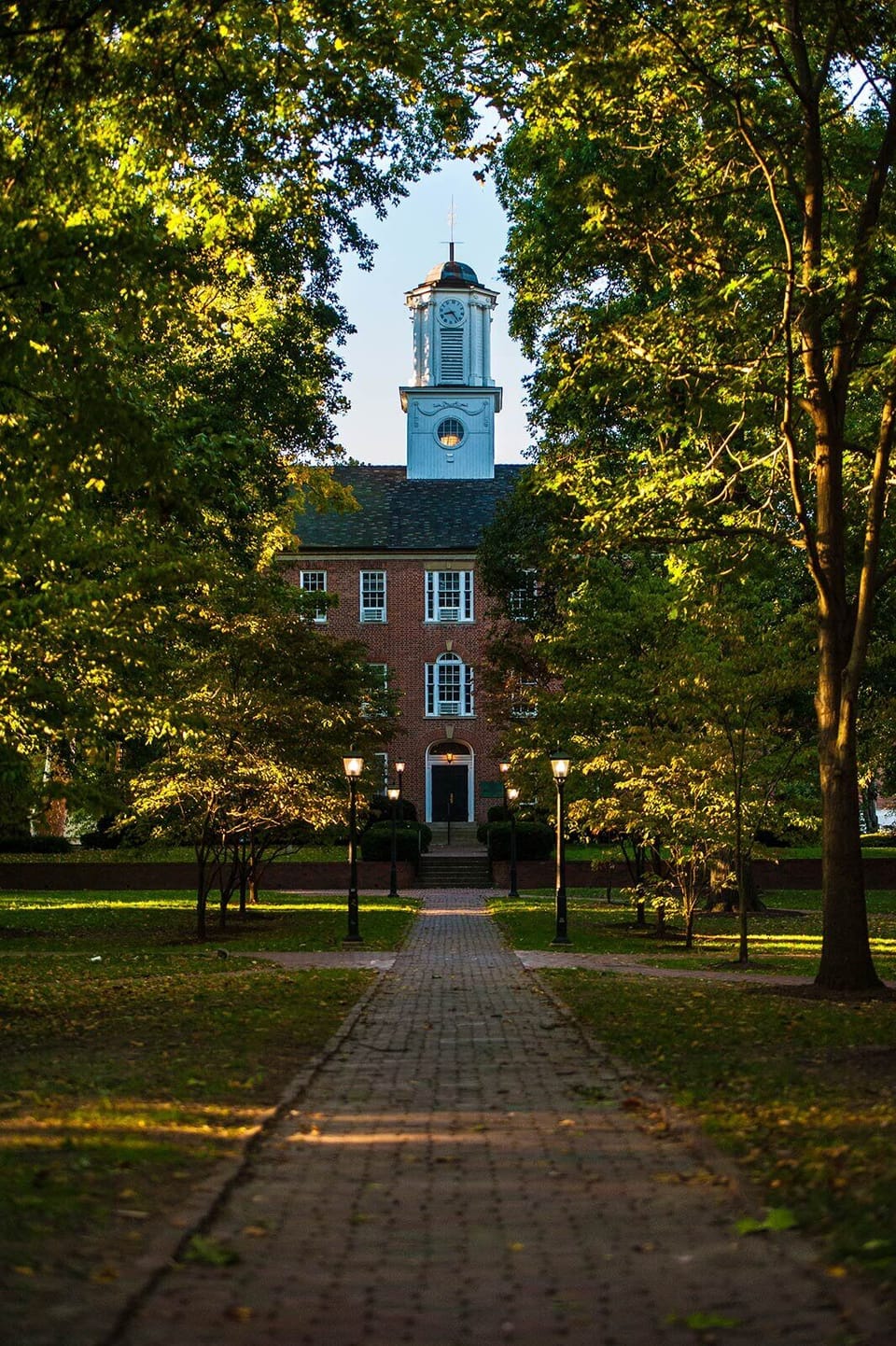 Admire classic brick architecture under a dramatic evening sky.