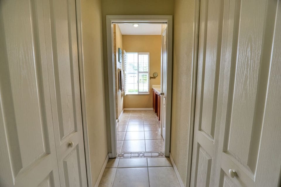 Closet and Hallway to Primary Bathroom