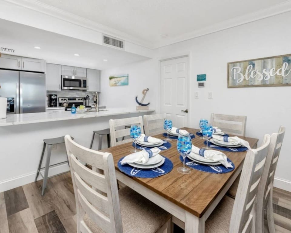 A spacious, open-concept dining area and living room with ample seating for dining and relaxation.