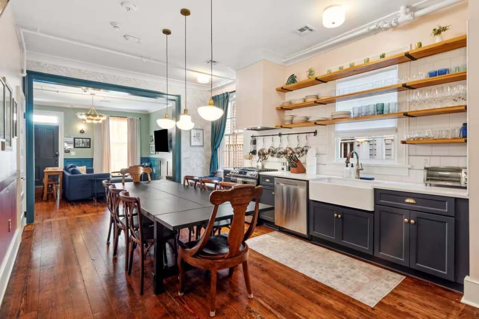 Fully equipped kitchen with a dining table, full set of appliances, and all the cookware, dishes, and utensils you need to prepare meals with ease.