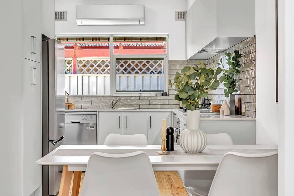 A contemporary kitchen has everything you need to cook your meals and a dishwasher for easy clean-up.