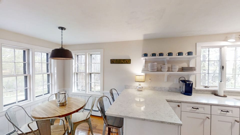 Kitchen area with separate dining area and island.