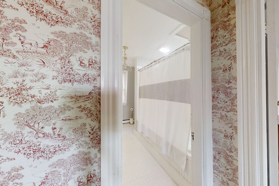 Second level full bath with a jacuzzi tub/ shower combo.