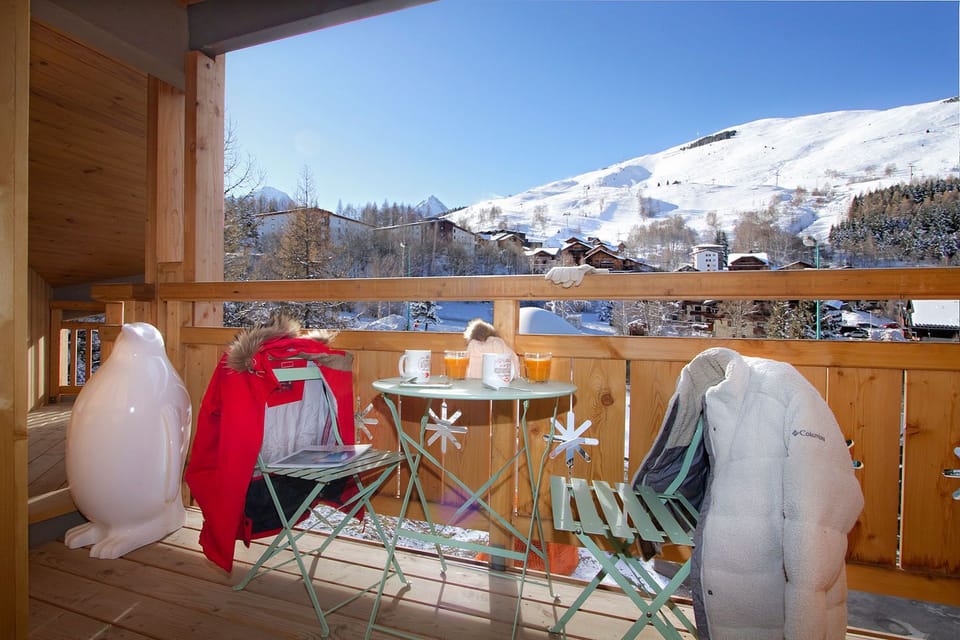 A serene balcony setting with breathtaking mountain views—perfect for sipping morning coffee or unwinding as the sun sets.