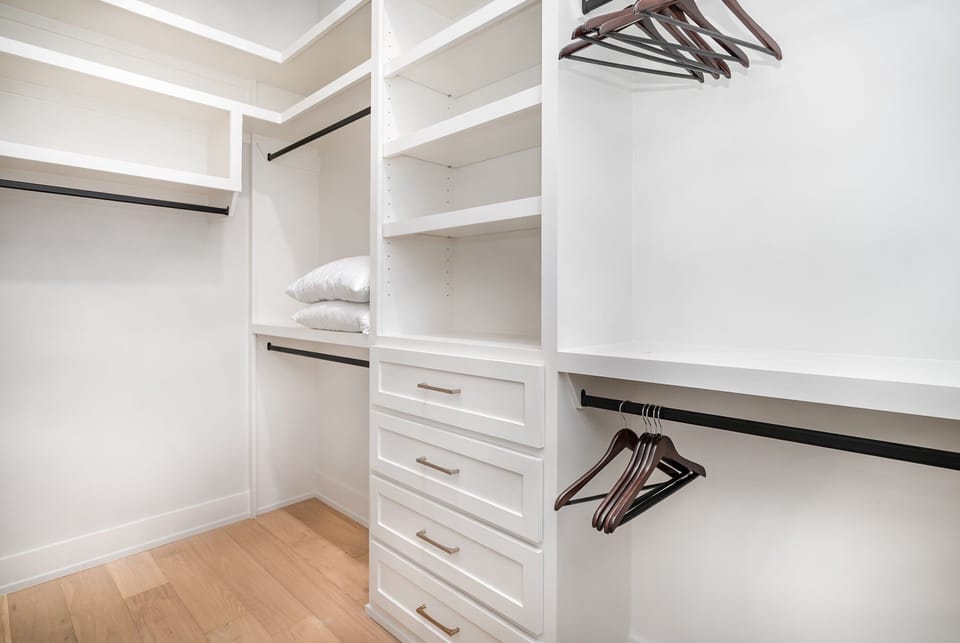 The primary bathroom has double vanities, a soaking tub, a walk-in shower, and a large walk-in closet. (3rd Floor)
