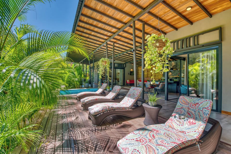 Plenty of colorful loungers invite you to relax in the warm sun by the cool pool